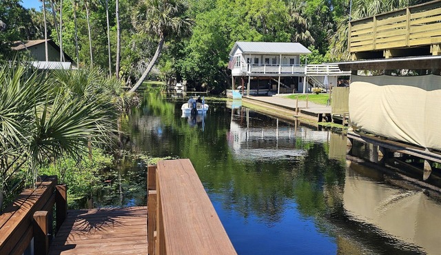 Cozy canal front house with its own boat ramp and dock. Amazing waterfront view.