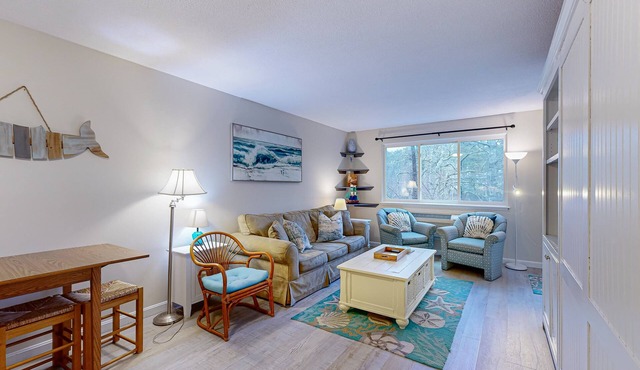 Cozy condo with golf course view, balcony, W/D, AC, & games