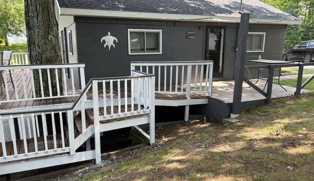 Cozy cottage in Glennie MI on all sports North Lake with deck, dock & firepit.