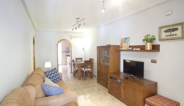 Cozy family apartment with patio and terrace and communal swimming pool