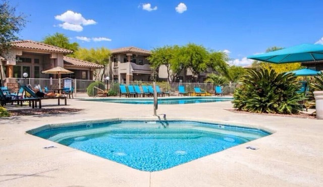 Cozy ground level resort style condo with heated pool/hot tub, and gym!