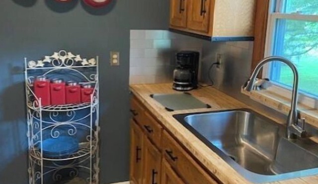 Cozy home conveniently located within city limits…Greenway across street!