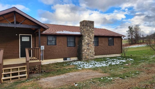 Cozy home located on 10 acres with a pond for fishing and kayaking.