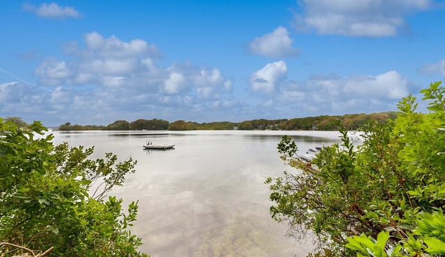 Cozy home on lake including local beach pass , hot tub, patio, W/D, & AC