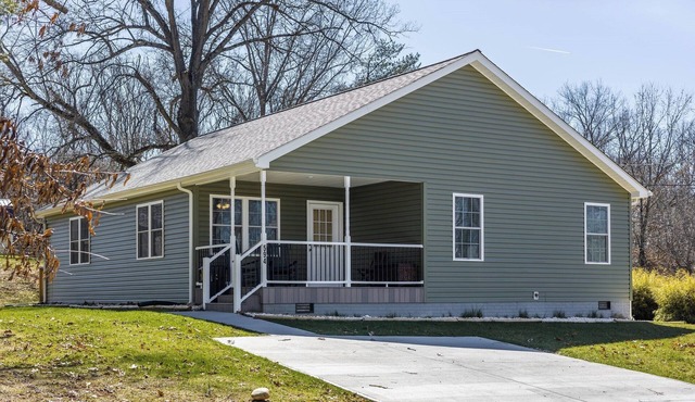 Cozy home with a modern kitchen, spacious living, serene bedrooms, and a private deck for relaxation