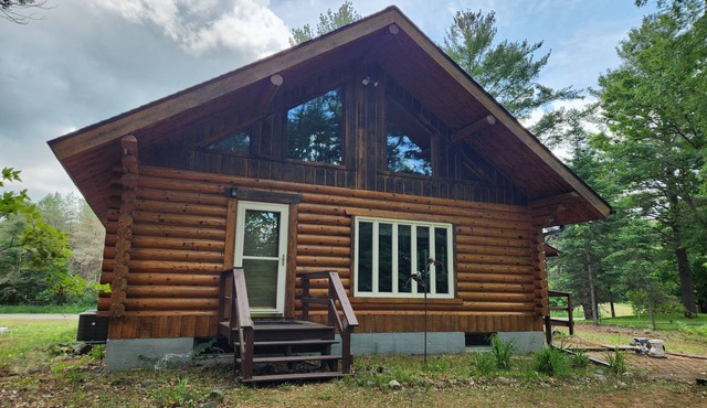 cozy lake house, full log cabin on beautiful shell lake, w/wonderful loft.