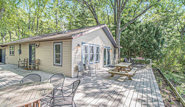 Cozy, lakefront cabin with gas grill and wrap-around deck.