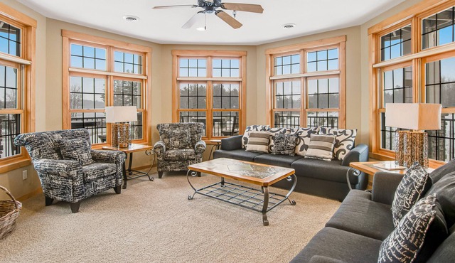Cozy lakefront condo with balcony, fireplace, AC, indoor pool, gym, & hot tubs