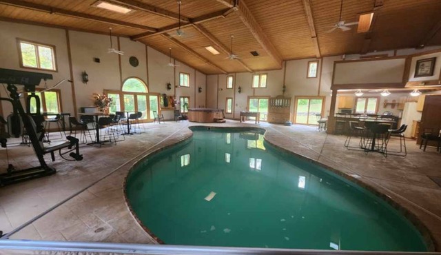Cozy lodge with indoor pool, hot tub, loft and more! Great for a close getaway!