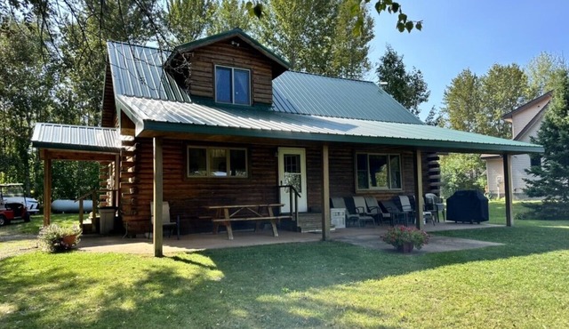 Cozy log cabin on South Manistique Lake with 100 feet of sandy beach, sunsets