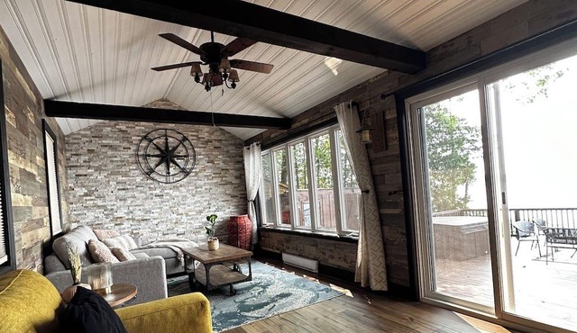 Cozy log cottage on the water with private dock.