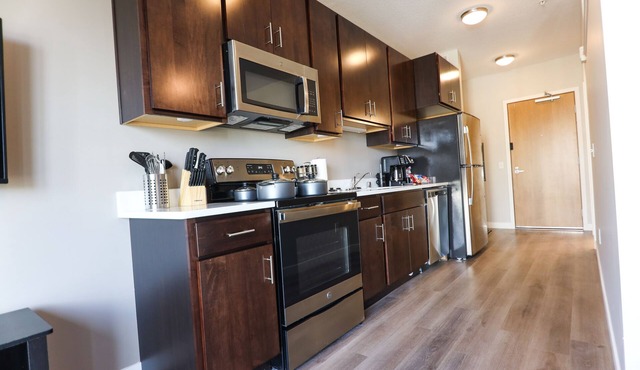 Cozy modern studio apartment with work out room, underground parking, and W/D