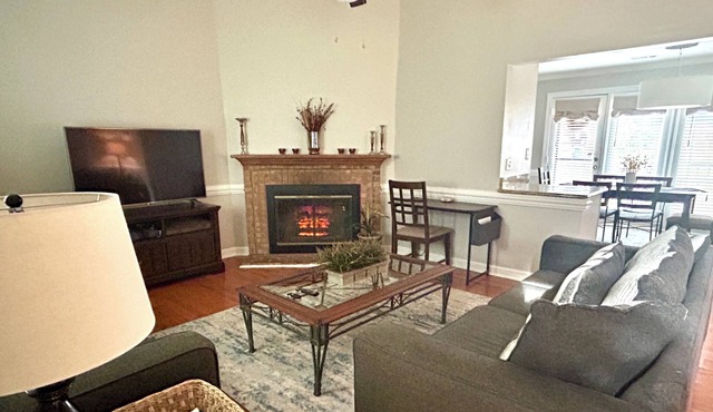 Cozy one level, 2 BR, 2 Bath TH in charming wooded community. Perfect location!