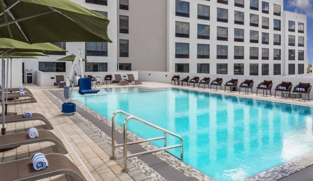 Cozy Retreat Steps to the Beach | Outdoor Pool, Dining | Free Shuttle , Parking