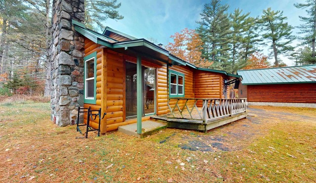 Cozy riverfront cabin with dock, fire pit, and WiFi on the 10-Lake Chain