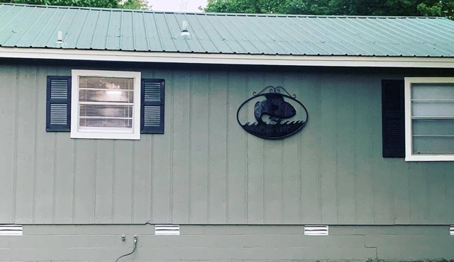 Cozy riverfront cabin with great outdoor space including a hot tub!