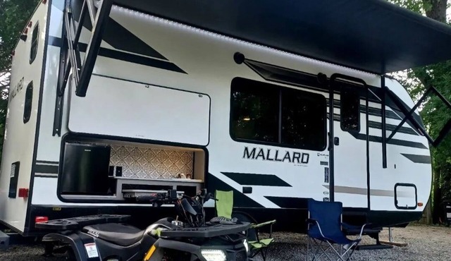 Cozy RV in our land with community private beach, fire pit, bring your boat.