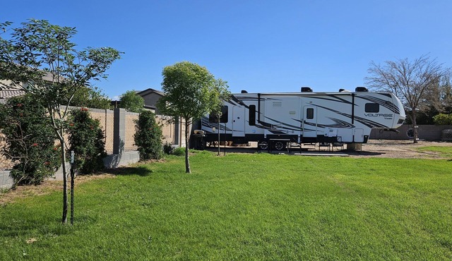 Cozy RV tucked back in a quiet property with plenty of room to relax
