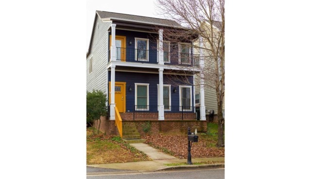 Cozy shotgun style house, centrally located in Northwest Arkansas.