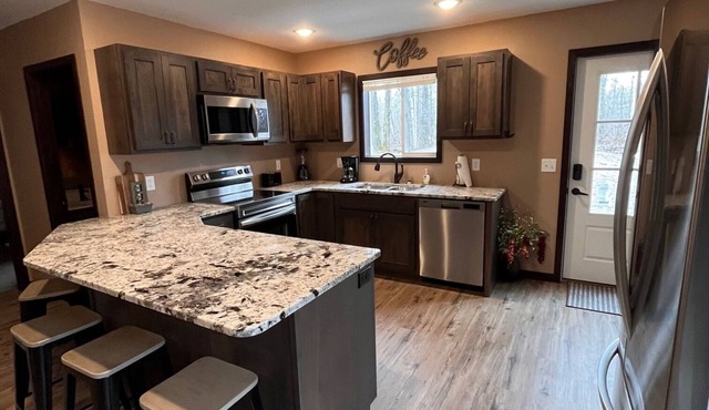 Cozy two level home - 2 minutes from beach on private wooded lot.