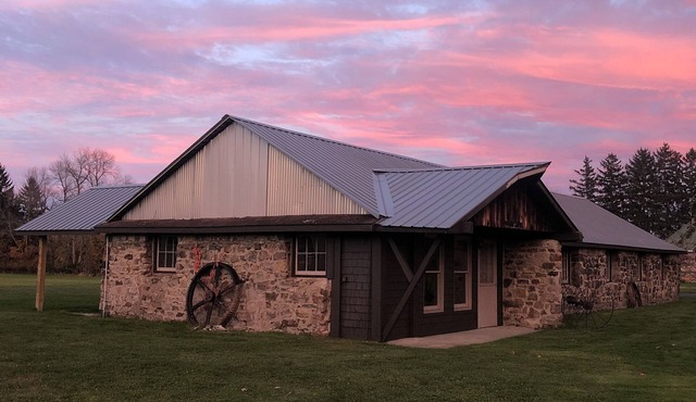 Cozy up in this rustic Stone Lodge and relax by the fireplace