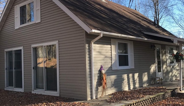 Cozy vacation home nestled in a quiet wooded area. Near town but private