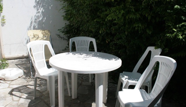 Cozy Village House with Courtyard, Walk to Beach & Shops