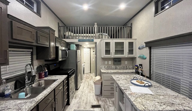 Cozy waterfront loft retreat with private dock, and lake access.