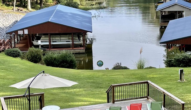Cozy waterfront retreat in a quiet cove directly off main lake.