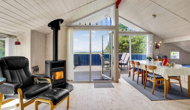 Cozy wooden house located directly on the Limfjord.