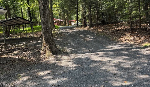 Cozy Woodland Retreat with Outdoor Fire Pit and Hot Tub.
