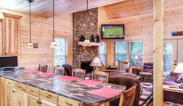 Creekfront cabin with cozy interiors, hot tub & game room.