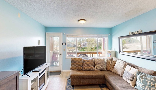 Creekside condo with beach access balcony full kitchen and ocean views