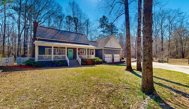 Creekside home with firepit, yard games, deck, wood stove, & W/D