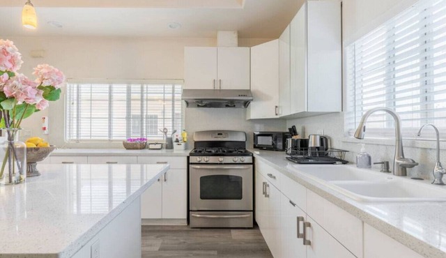 Crowning Luxury: 3 King Suites, 3 Bath Retreat, Workstations, Lightspeed Internet, and On-Site Laundry with Parking.