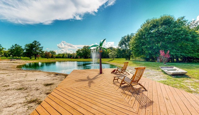 Custom Home with Guesthouse, Pond, Swimming Deck, Beach & Tropical Bar