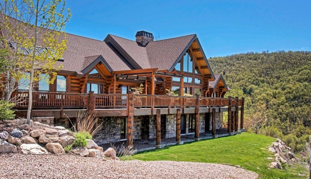 Custom log home nestled in the mountains. Stunning valley views from every room.
