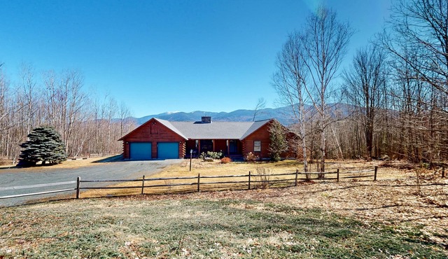 Custom log home with enormous deck & stunning mountain views