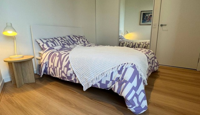 Cute bedroom in a shared apartment with private bathroom in Burwood Brickworks.