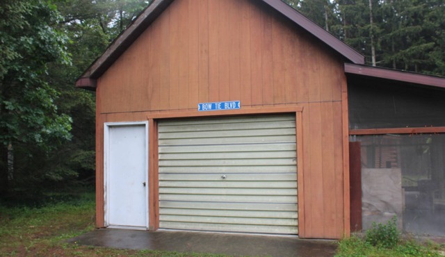 Cute cabin and pole building with bathroom facilities and kitchen area