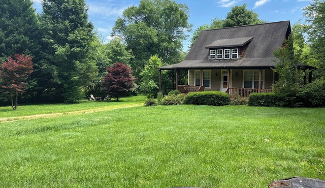 Cute cottage just outside Asheville with EV charger. Won’t you be my neighbor?