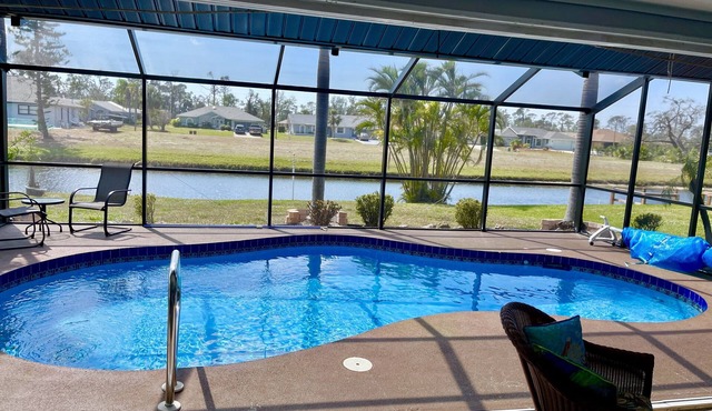 cute house with pool with canal view