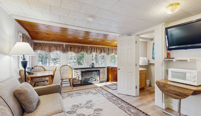 Cute Riverfront Cabin in Great Location w/Shared Pool, Kitchenette, & Free WiFi