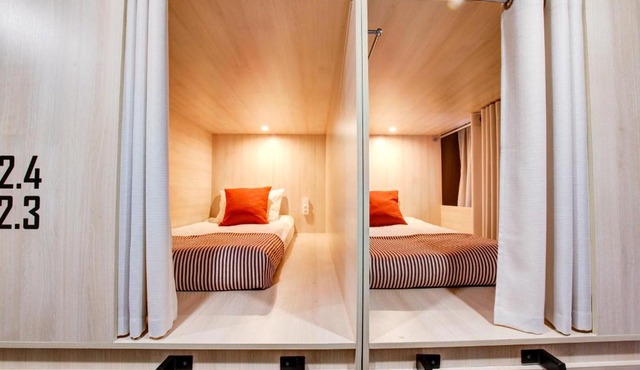 Dad and Cat Capsule Hotel