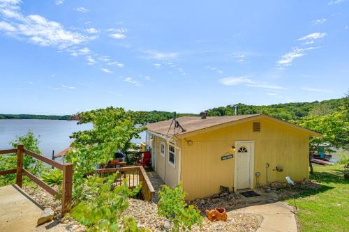 Deck with Covered Dock! Lakefront Ozark Cottage