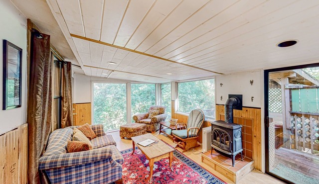 Delightful coastal escape with private hot tub, generous patio, & nature views