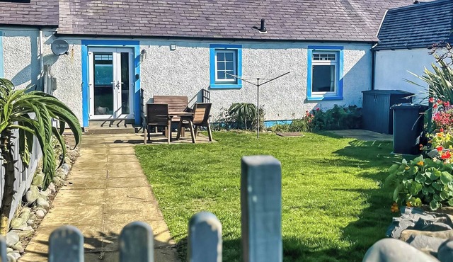 Delightful cottage overlooking Luce Bay, with open fire and enclosed garden.