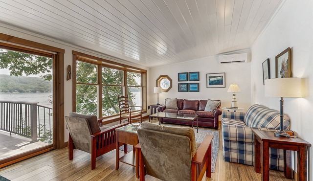 Delightful lakefront house with furnished deck, balcony, and private dock