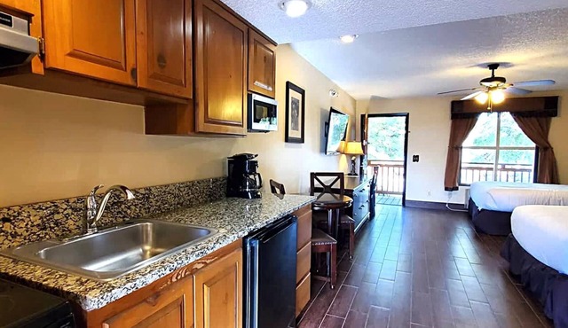 Deluxe Suite with Kitchenette and Balcony, Steps to Rodeo and Pool! 253