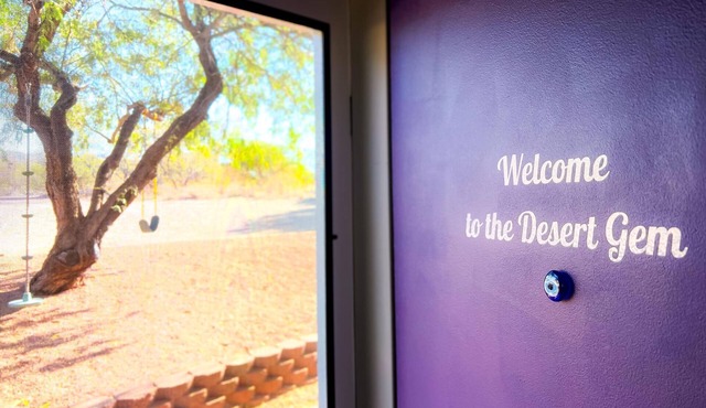 Desert Gem Guest House nestled among lush Mesquite trees.